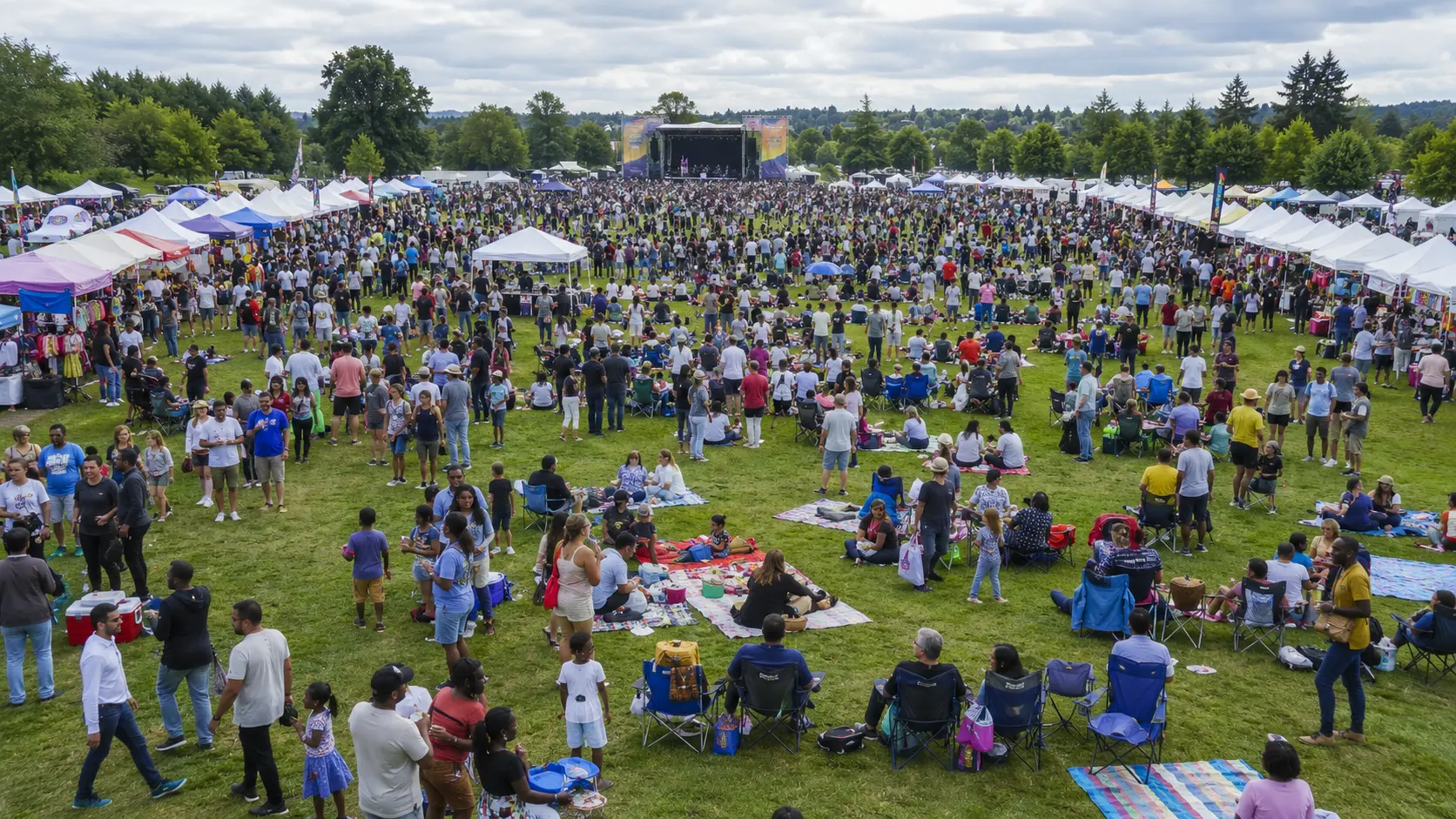 Aerial view of the festival grounds showing vendor rows, seating and the main stage